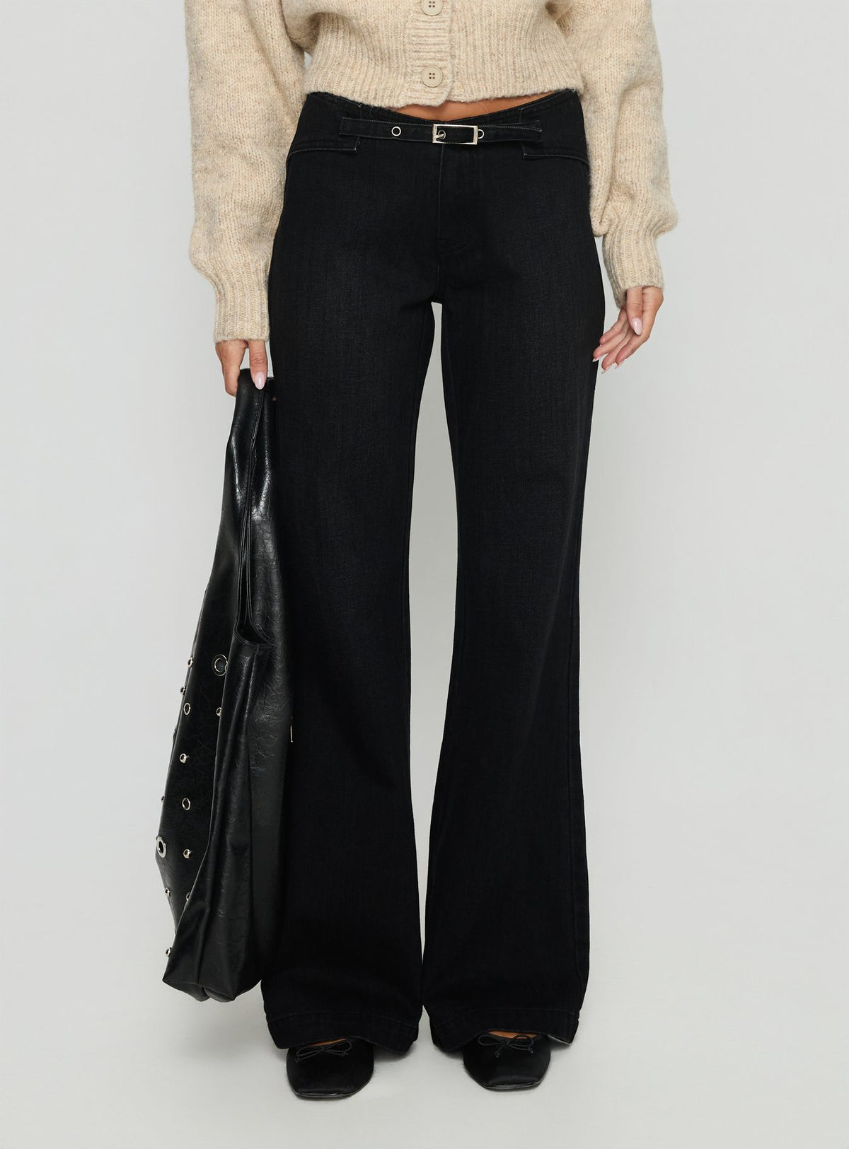 side view of model wearing Princess Polly Slow Ride Mid Rise Bootleg Belted Jeans Washed Black Mid Rise Jeans 