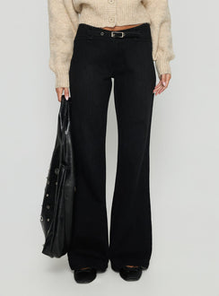 side view of model wearing Princess Polly Slow Ride Mid Rise Bootleg Belted Jeans Washed Black Mid Rise Jeans 