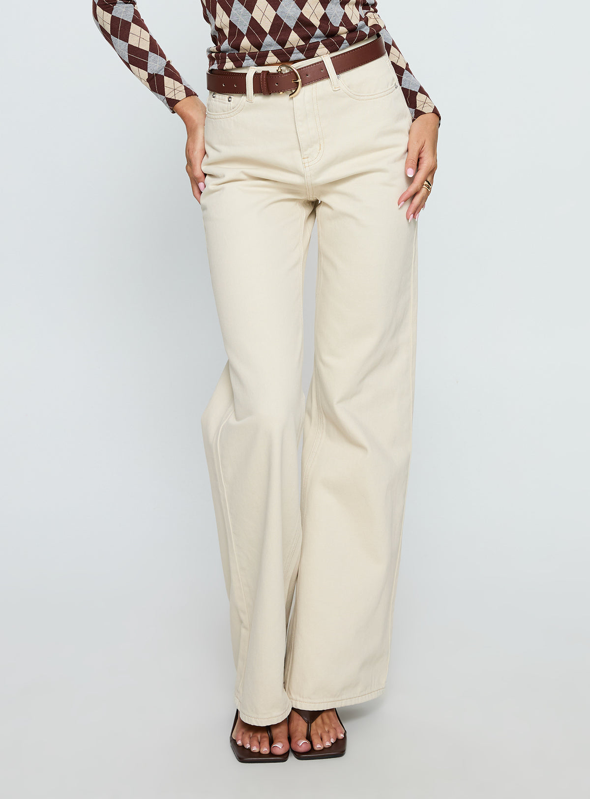 back view of model wearing Princess Polly Maple Mid Rise Flare Jeans Ecru High Rise Jeans Jeans 