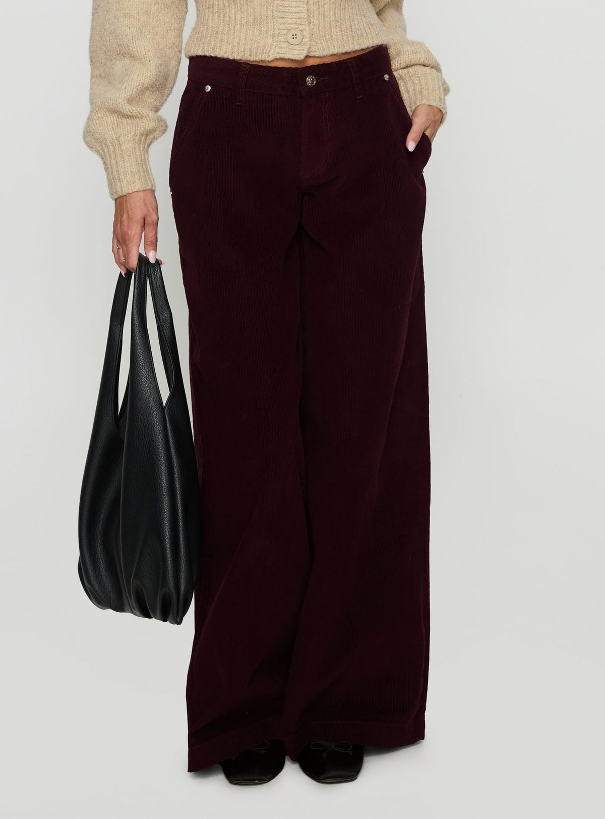 side view of model wearing Princess Polly Jacynda Low Waist Wide Leg Corduroy Jeans Currant Mid Rise Jeans Jeans 