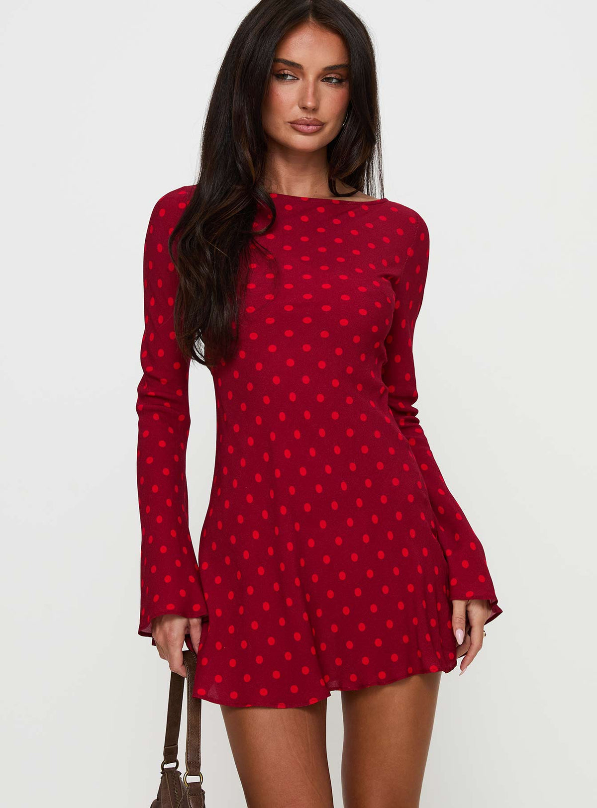side view of model wearing Princess Polly Good Graces Long Sleeve Mini Dress Red Dot Boat Neck 