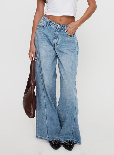 back view of model wearing Princess Polly Ringer Low Rise Wide Leg Jeans Blue Mid Rise Jeans Jeans 