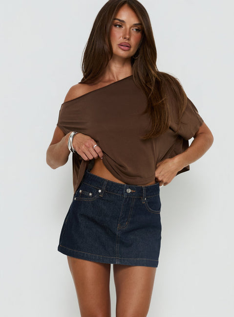   front view of model wearing Princess Polly Nicolina Low Rise Denim Mini Skirt Raw Denim Mini Skirts Skirts 
