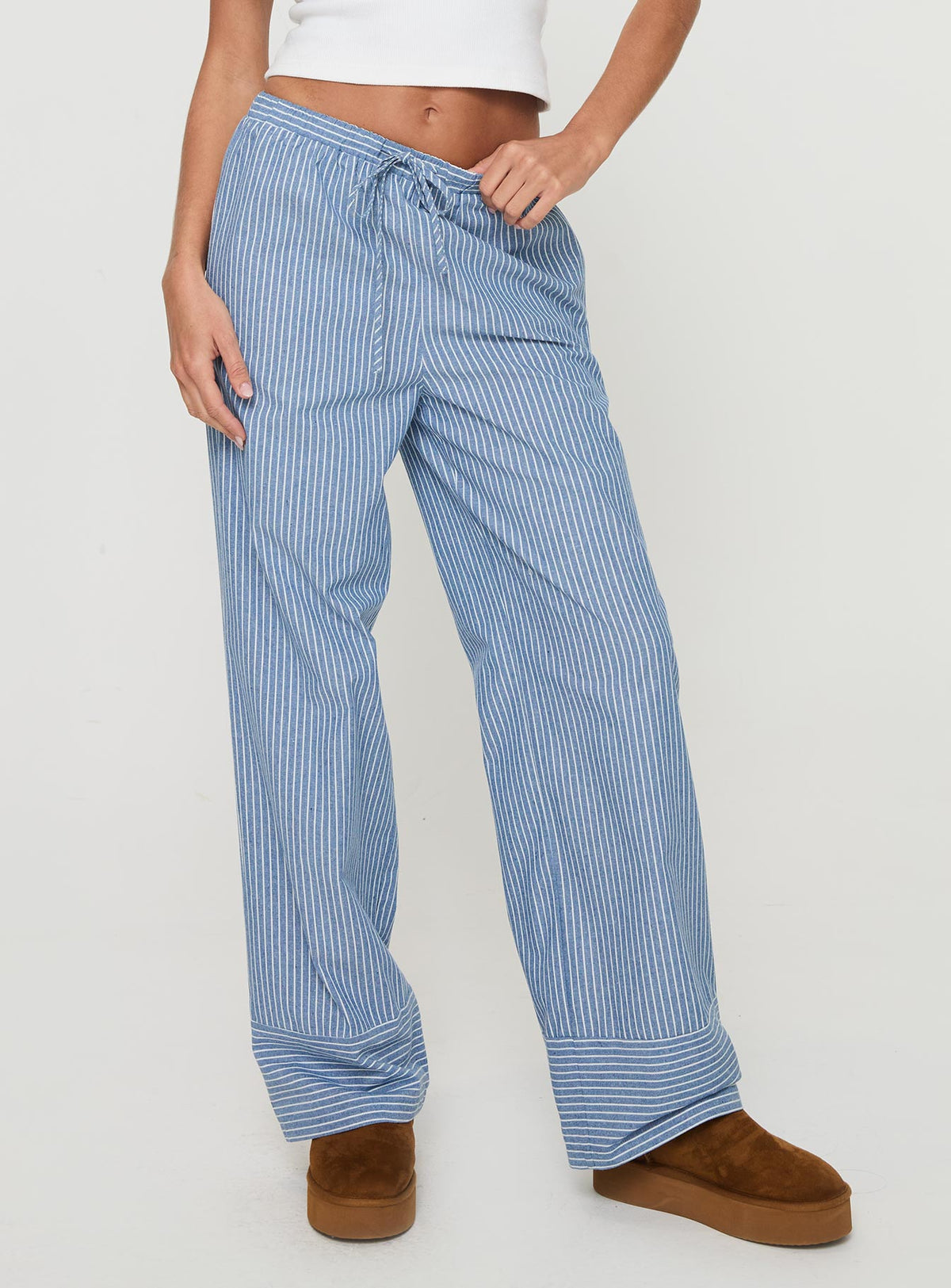 side view of model wearing Princess Polly Veridian Pants Blue Stripe Mid Rise Pants Pants 