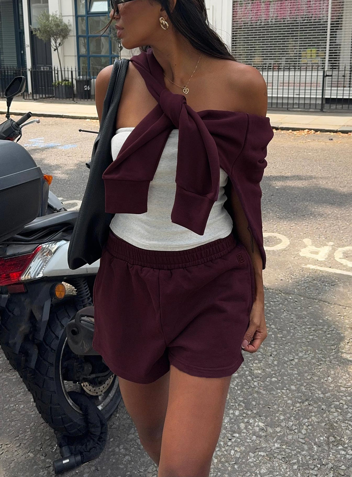 side view of model wearing Princess Polly All Day Short Wine High Waisted Shorts 