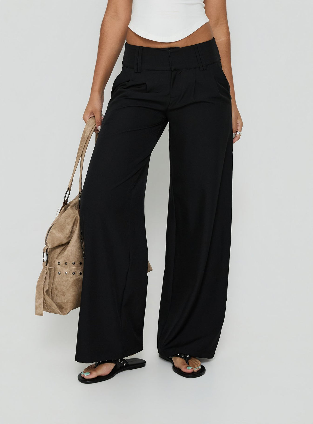 Showcasing the Loved Up Low Rise Baggy Pants Black Tall in womens-regular-pants with low-rise waist product Princess Polly