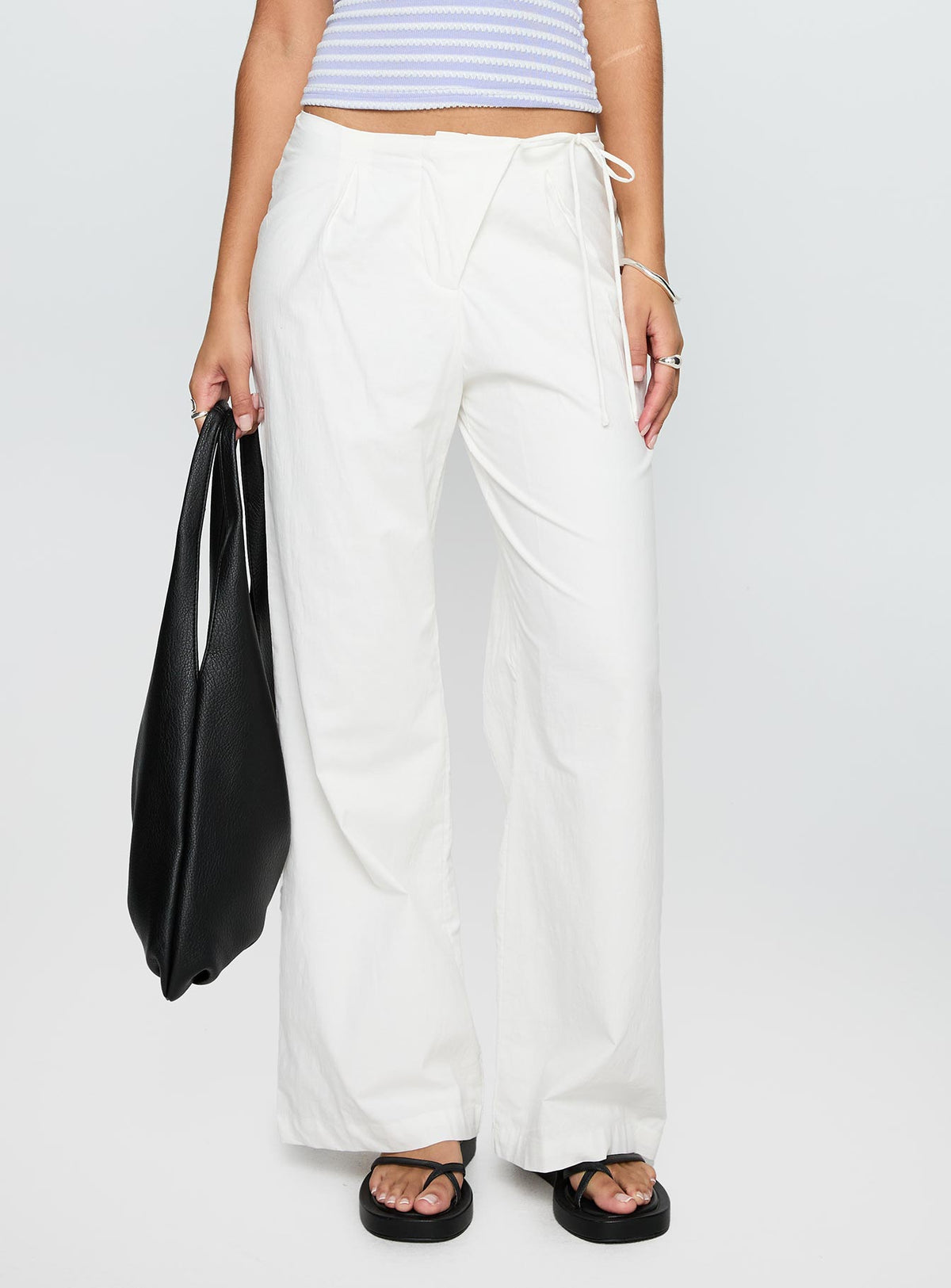 front view of model wearing Princess Polly Leyah Tie Side Pants White Low Rise Pants Pants 