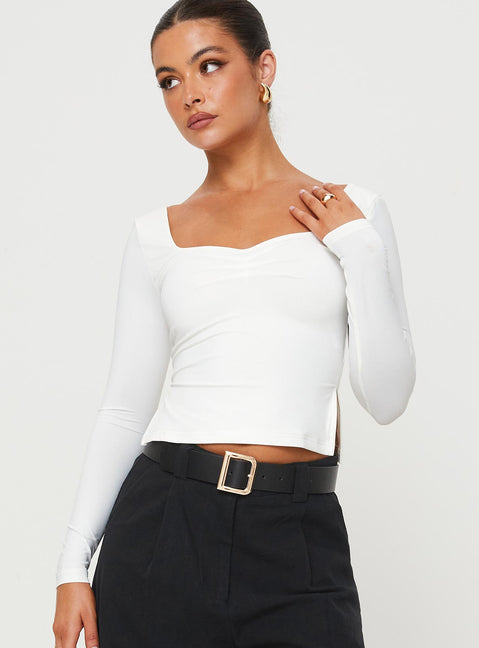 Front view of model wearing  front Princess Polly Full Sleeves Asymmetric Neckline  Rehna Long Sleeve Top White