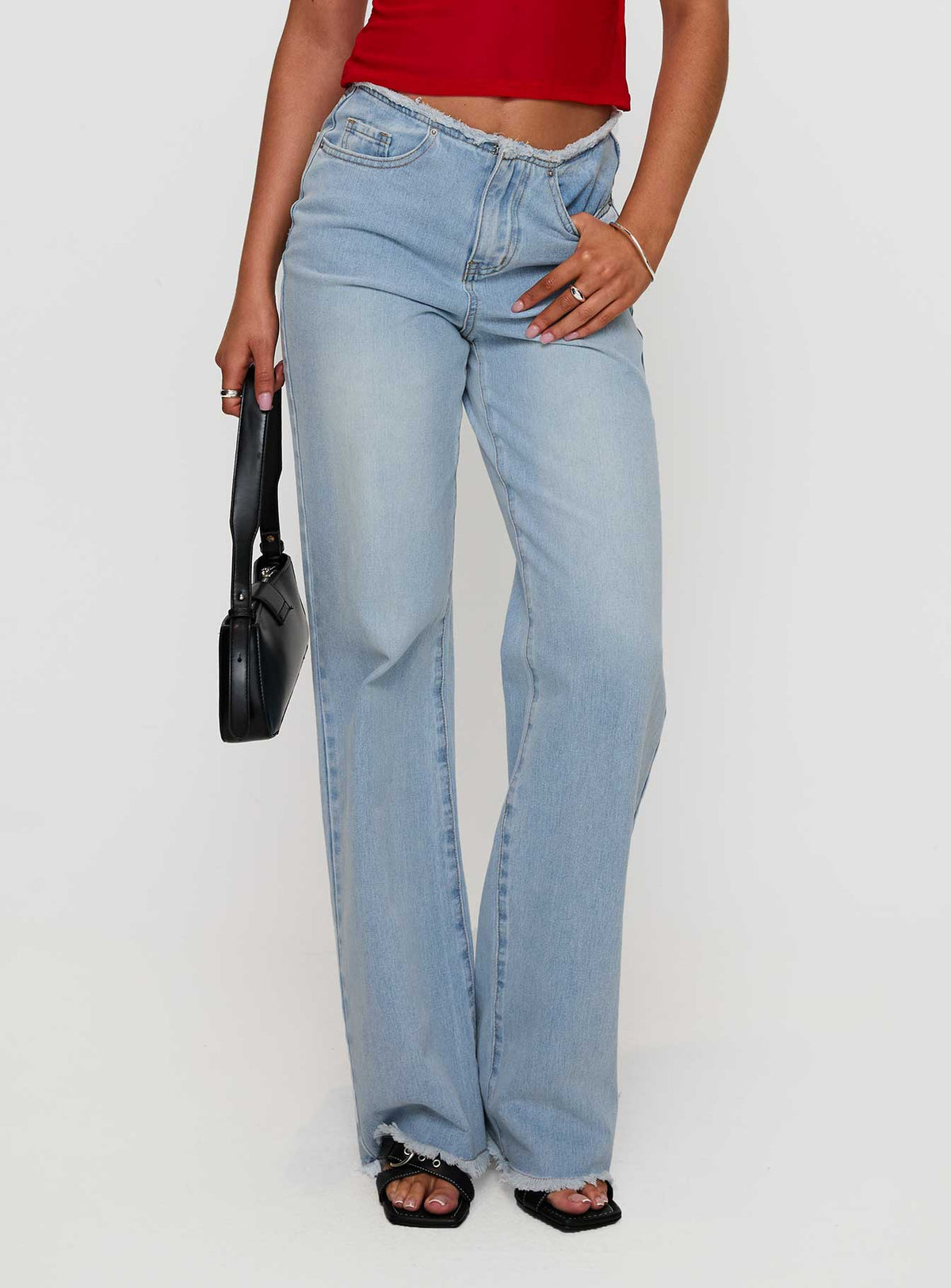 front view of model wearing Princess Polly Hawke Frayed Mid Rise Straight Leg Jeans Mid Blue High Rise Jeans Jeans 