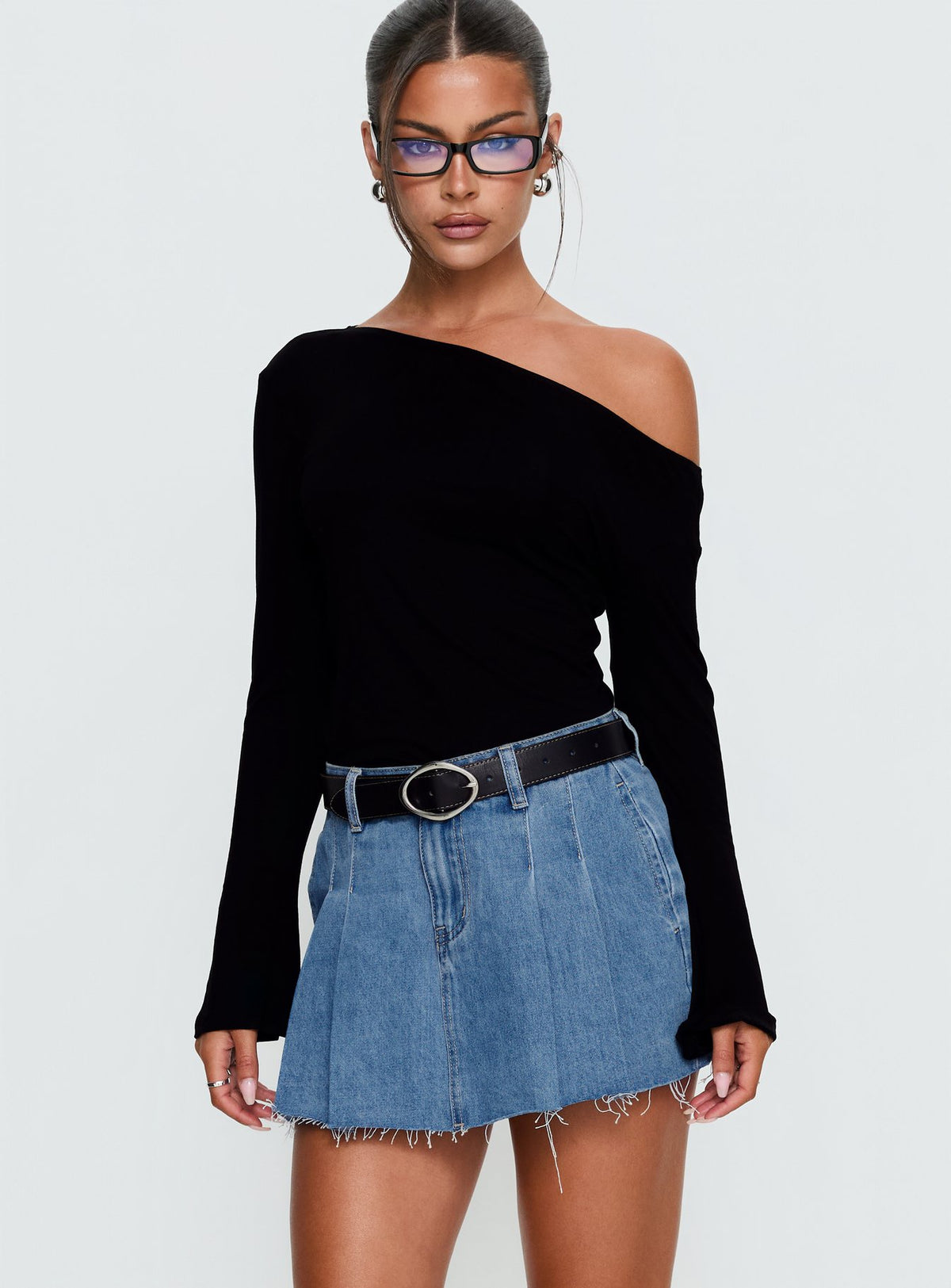back view of model wearing Princess Polly Debera Pleated Mini Skirt Mid Blue Wash Skirts 