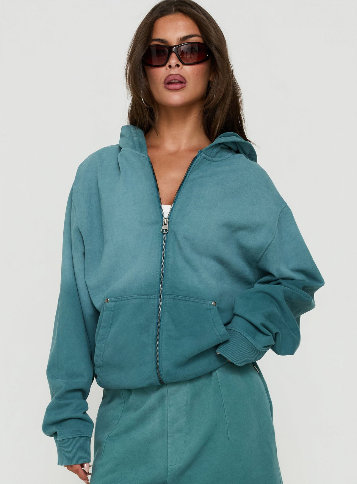 Featuring the AT Zip Through Oversized Hoodie in Washed Teal womens-jumpers with short length front view of model wearing Princess Polly