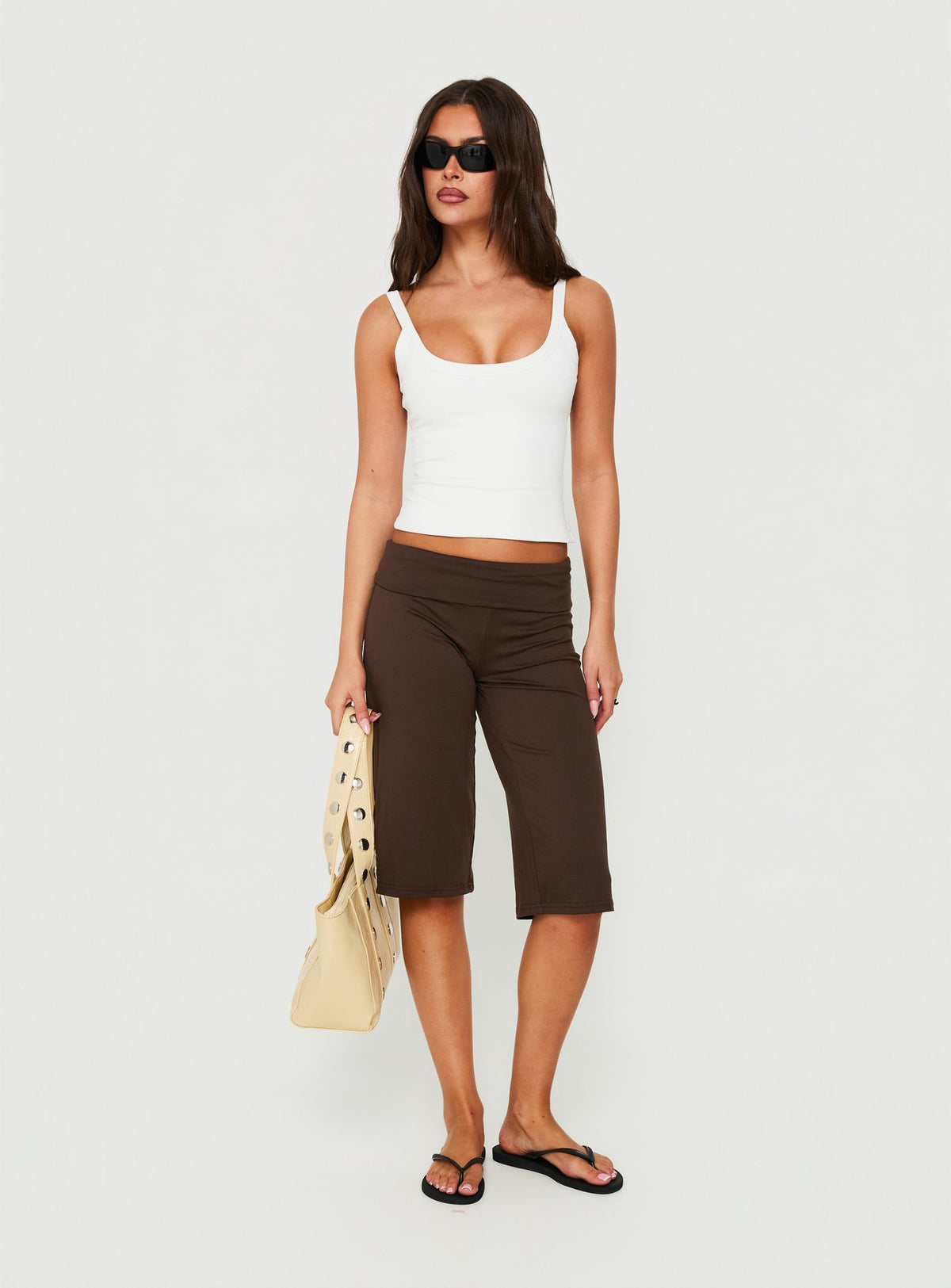 Showcasing the Laroy Folded Capri Pant Chocolate in womens regular pants with high-rise waist front view of model wearing