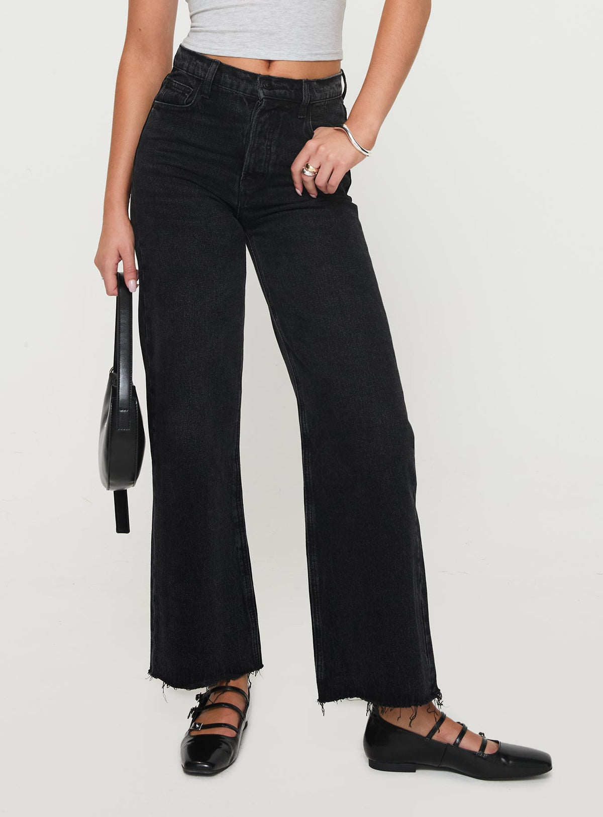 side view of model wearing Princess Polly Fawcett High Rise Straight Leg Jeans Washed Black High Rise Jeans Jeans 