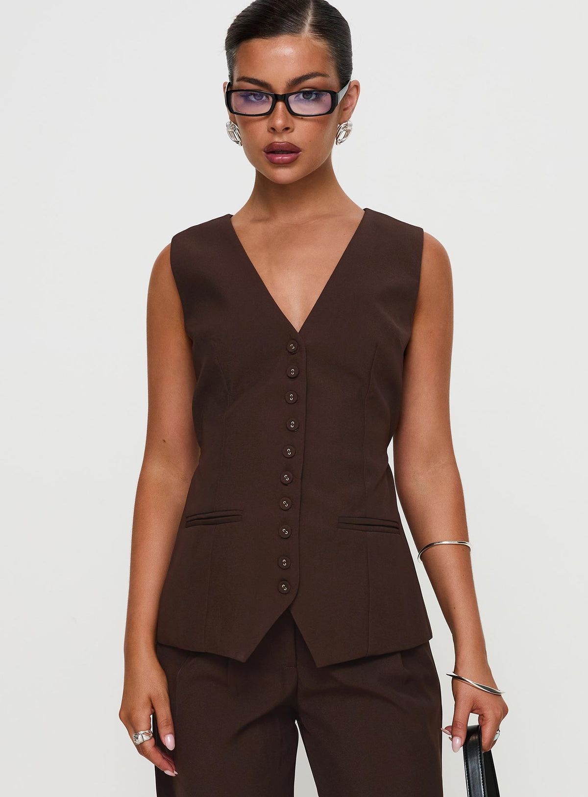front view of model wearing Princess Polly Ambient Longline Button Up Top Chocolate Sleeveless V-Neck 