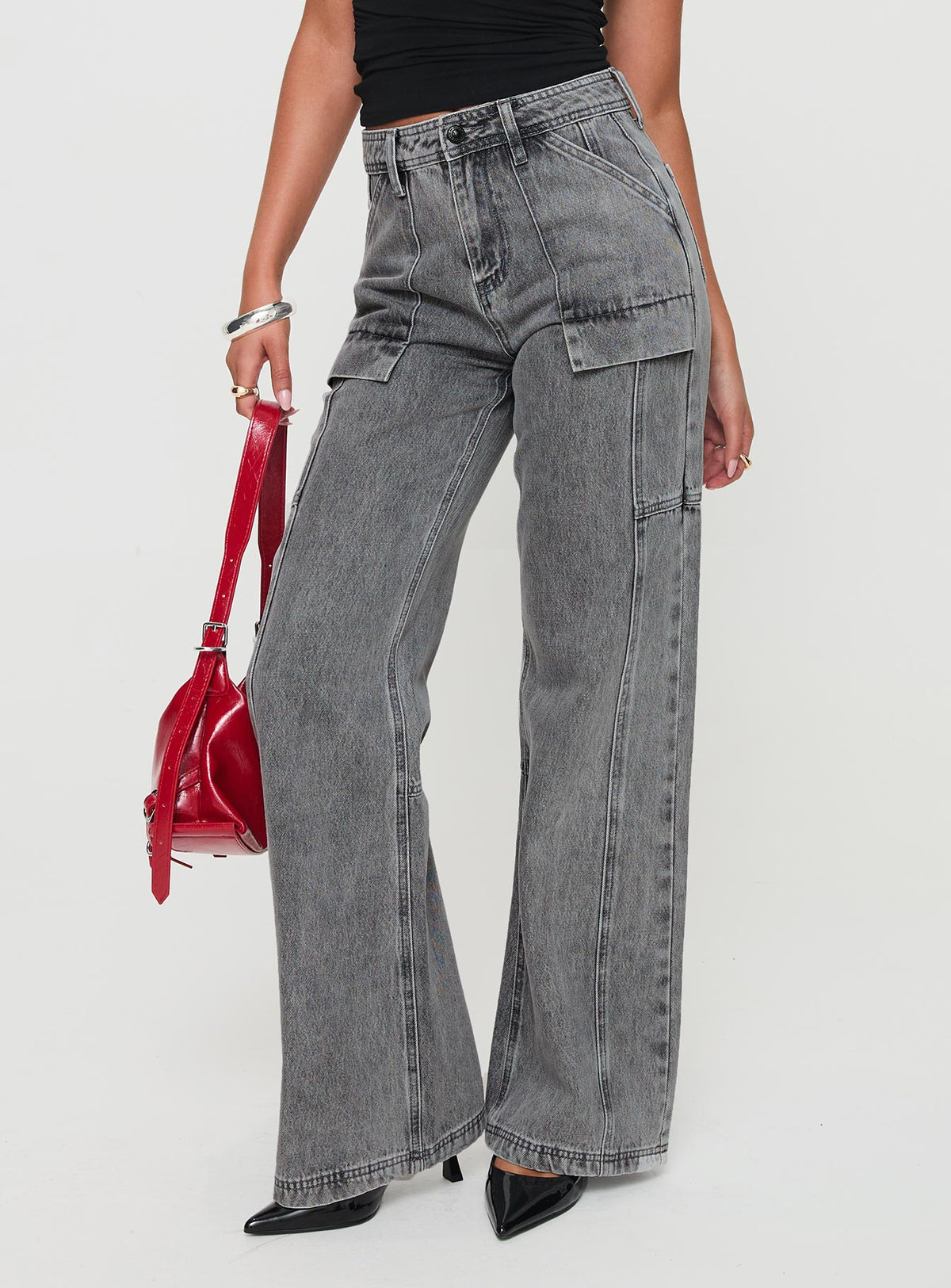 side view of model wearing Princess Polly Chad High Rise Flared Cargo Jeans Washed Grey Mid Rise Jeans Jeans 