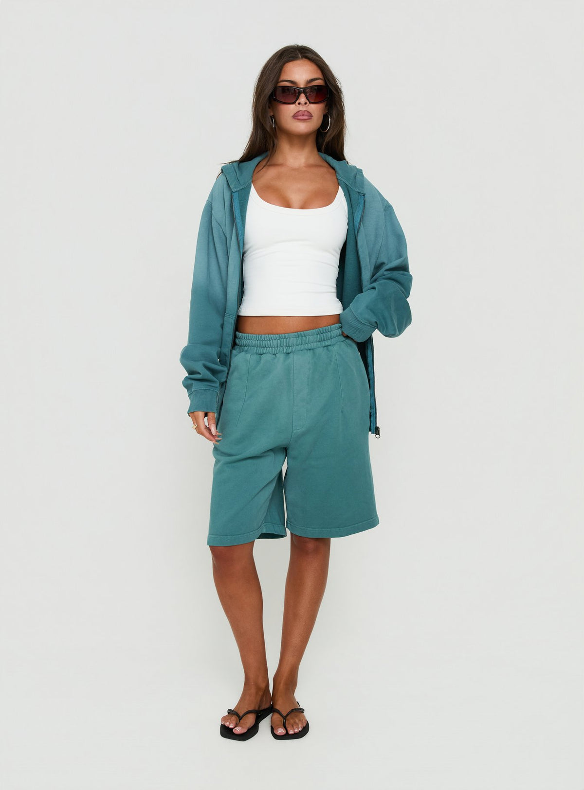 Style the AT Fleece Baggy Jort in Washed Teal womens regular pants with mid-rise front view of model wearing Princess Polly