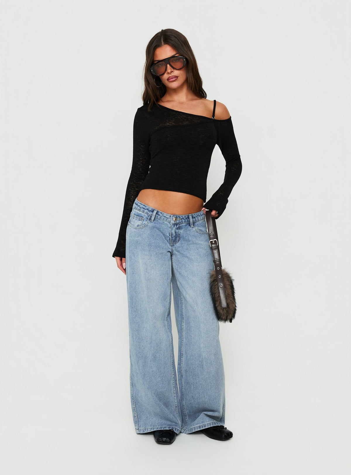 Featuring Picco Ultra Low Rise Wide Leg Jeans Light Blue Wash Petite in womens-jeans styled with a low-rise waist front view of model wearing Princess Polly