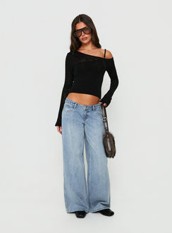 Featuring Picco Ultra Low Rise Wide Leg Jeans Light Blue Wash Petite in womens-jeans styled with a low-rise waist front view of model wearing Princess Polly