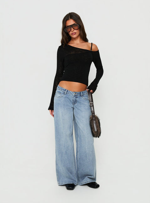 Featuring Picco Ultra Low Rise Wide Leg Jeans Light Blue Wash Petite in womens-jeans styled with a low-rise waist front view of model wearing Princess Polly