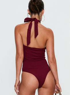 back view of model wearing Princess Polly Bridey Cut Out Bodysuit Red Sleeveless Bodysuit 