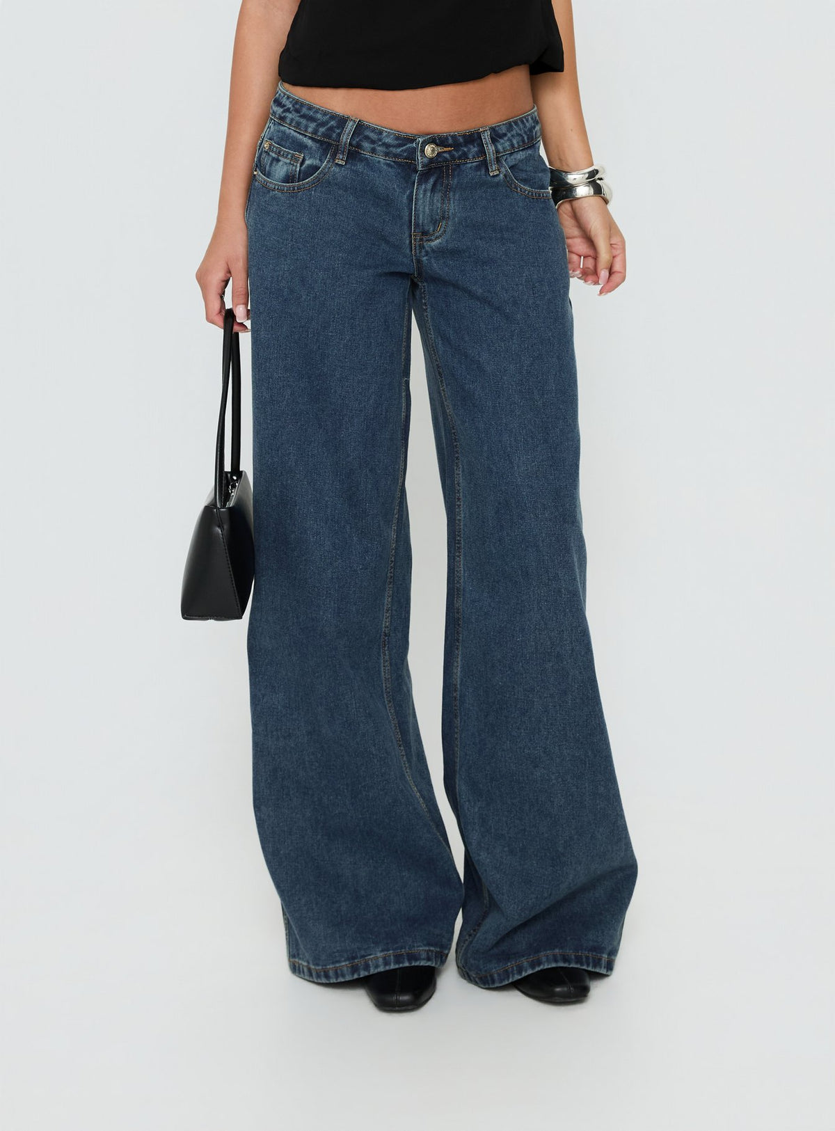 Designed with the Picco Ultra Low Rise Wide Leg Jeans Dark Blue Wash Petite in womens-jeans featuring low-rise waist detail Princess Polly