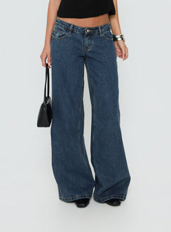 Designed with the Picco Ultra Low Rise Wide Leg Jeans Dark Blue Wash Petite in womens-jeans featuring low-rise waist detail Princess Polly