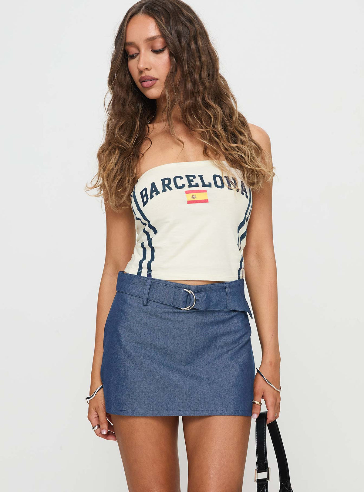   side view of model wearing Princess Polly Marine Skirt Indigo Mini Skirts Skirts 