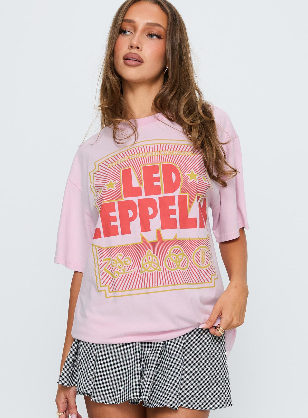 front view of model wearing Princess Polly Led Zeppelin Oversized Vintage Graphic Top Pink Half Sleeves Crew Neck 