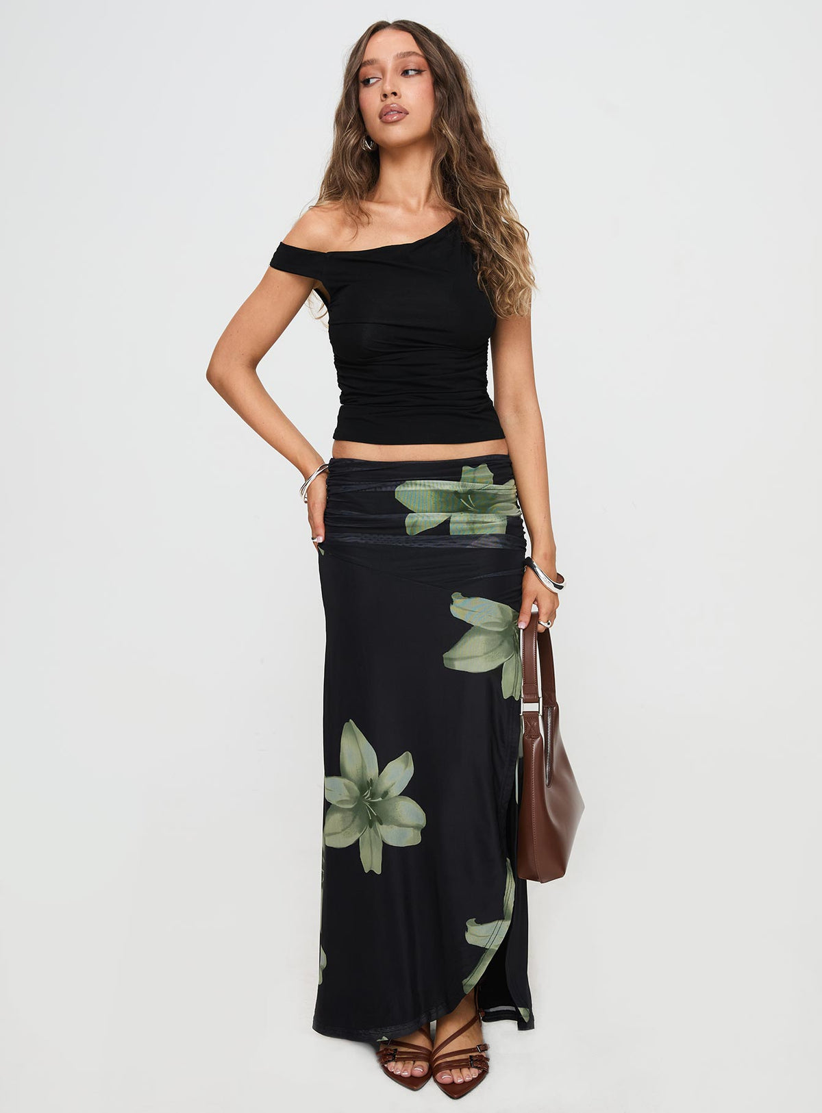   front view of model wearing Princess Polly Cooperi Maxi Skirt Black Floral Maxi Skirts Skirts 