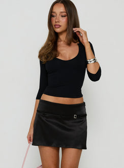 Featuring the Losanna Buckle Mini Skirt Black womens-skirts in mini length side view of model wearing Princess Polly