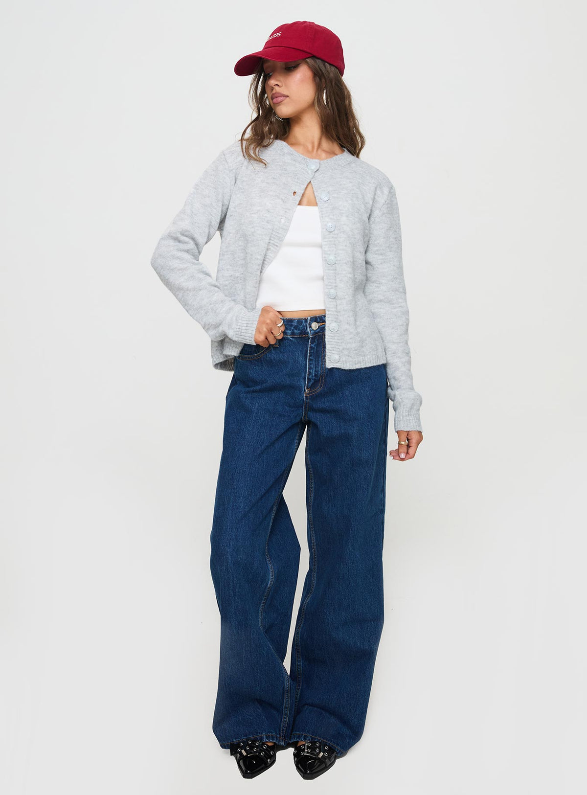 side view of model wearing Princess Polly Shima Low Rise Slouch Jeans Mid Wash Mid Rise 
