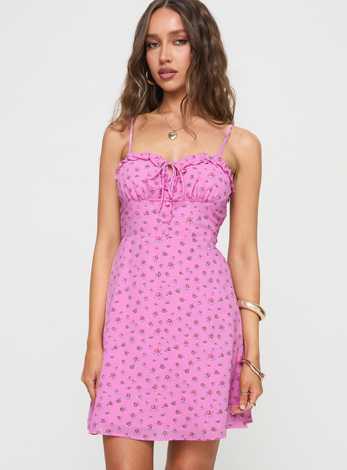 side view of model wearing Princess Polly Love Birds Mini Dress Pink Floral Sweetheart Neckline 