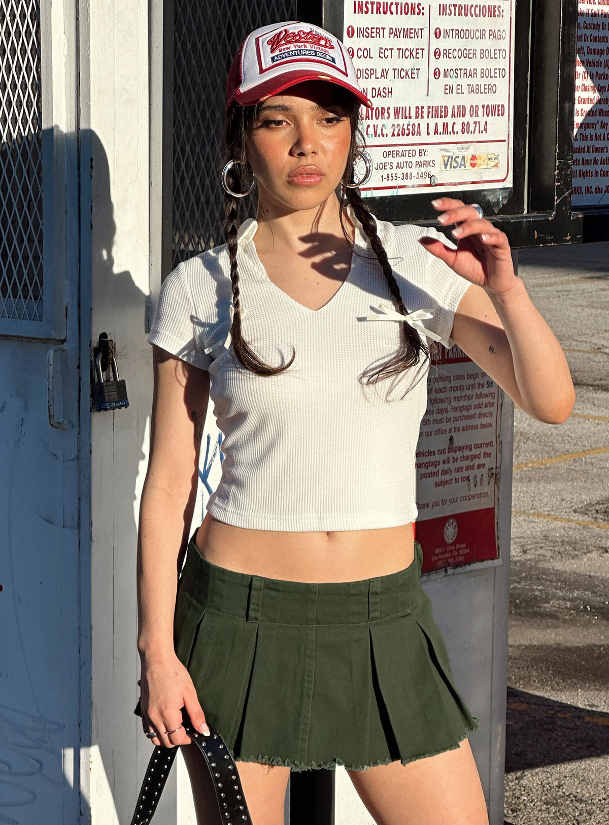 front view of model wearing Princess Polly Allure 90's Mini Skort Olive High Waisted Shorts 