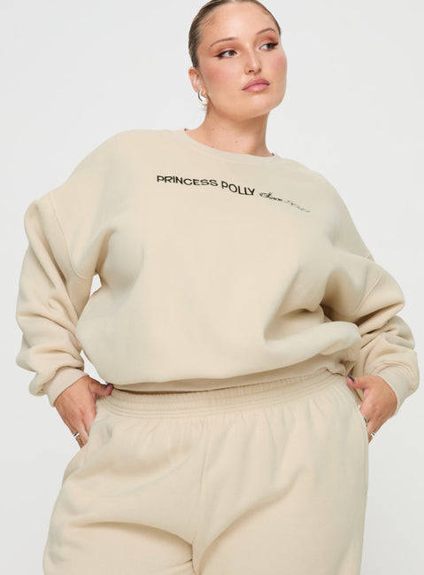 side view of model wearing Princess Polly Princess Polly Crew Neck Sweatshirt Block / Cursive Text Stone Curve regular Jumpers 