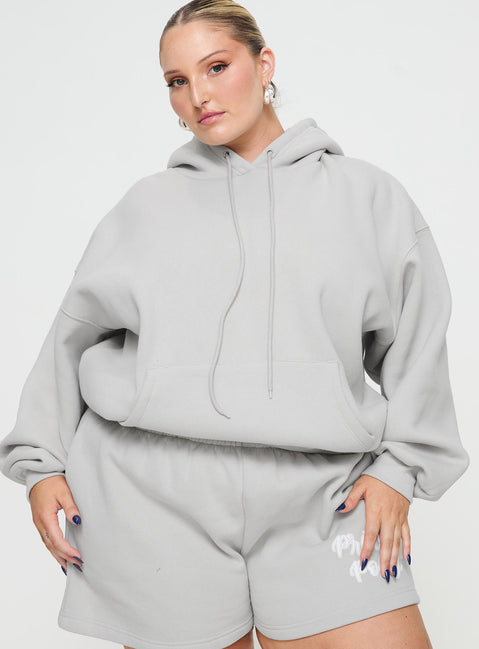 front view of model wearing Princess Polly Princess Polly Hooded Sweatshirt Puff Text Grey Curve Jumpers 