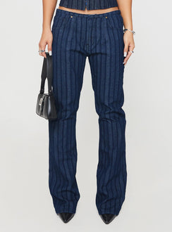 back view of model wearing Princess Polly Charismatic Low Rise Flared Jeans Dark Pinstripe Low Rise Jeans Jeans 