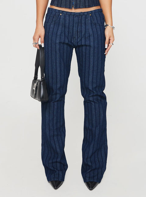 back view of model wearing Princess Polly Charismatic Low Rise Flared Jeans Dark Pinstripe Low Rise Jeans Jeans 
