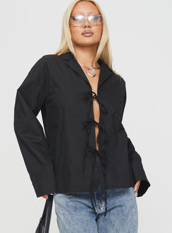 side view of model wearing Princess Polly Spiri Shirt Black Full Sleeves V-Neck 