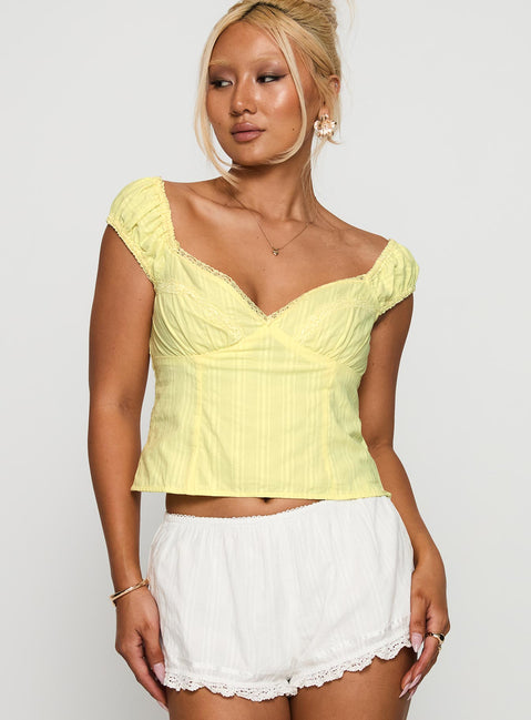 front view of model wearing Princess Polly Fyrie Top Yellow Sleeveless Sweetheart 