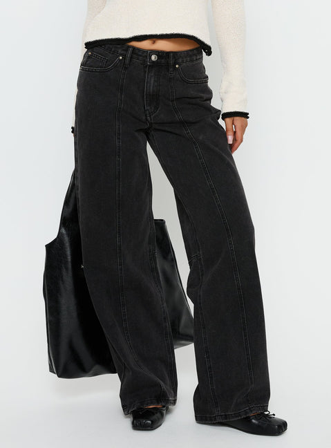 side view of model wearing Princess Polly Lando Low Rise Straight Leg Jeans Washed Black Low Rise Jeans Jeans 