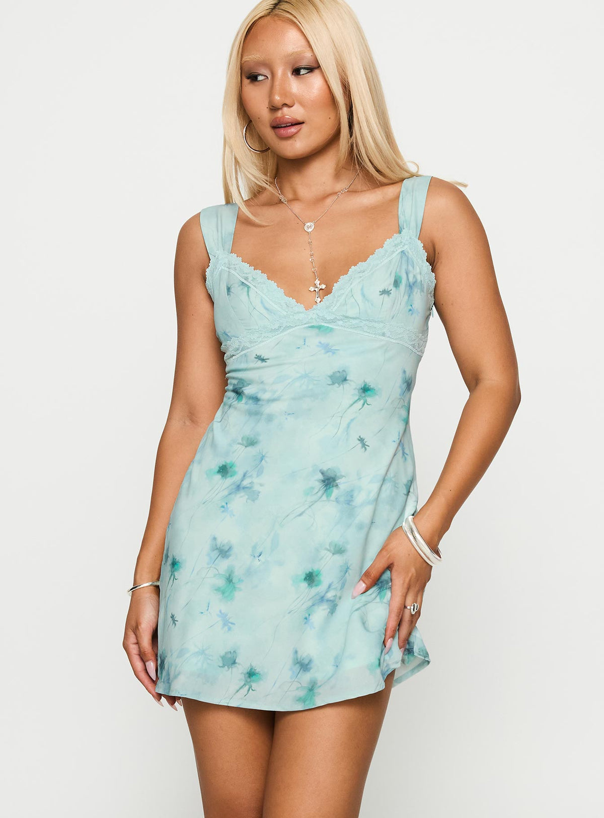 back view of model wearing Princess Polly Love Beckons Mini Dress Blue Floral Plunger 
