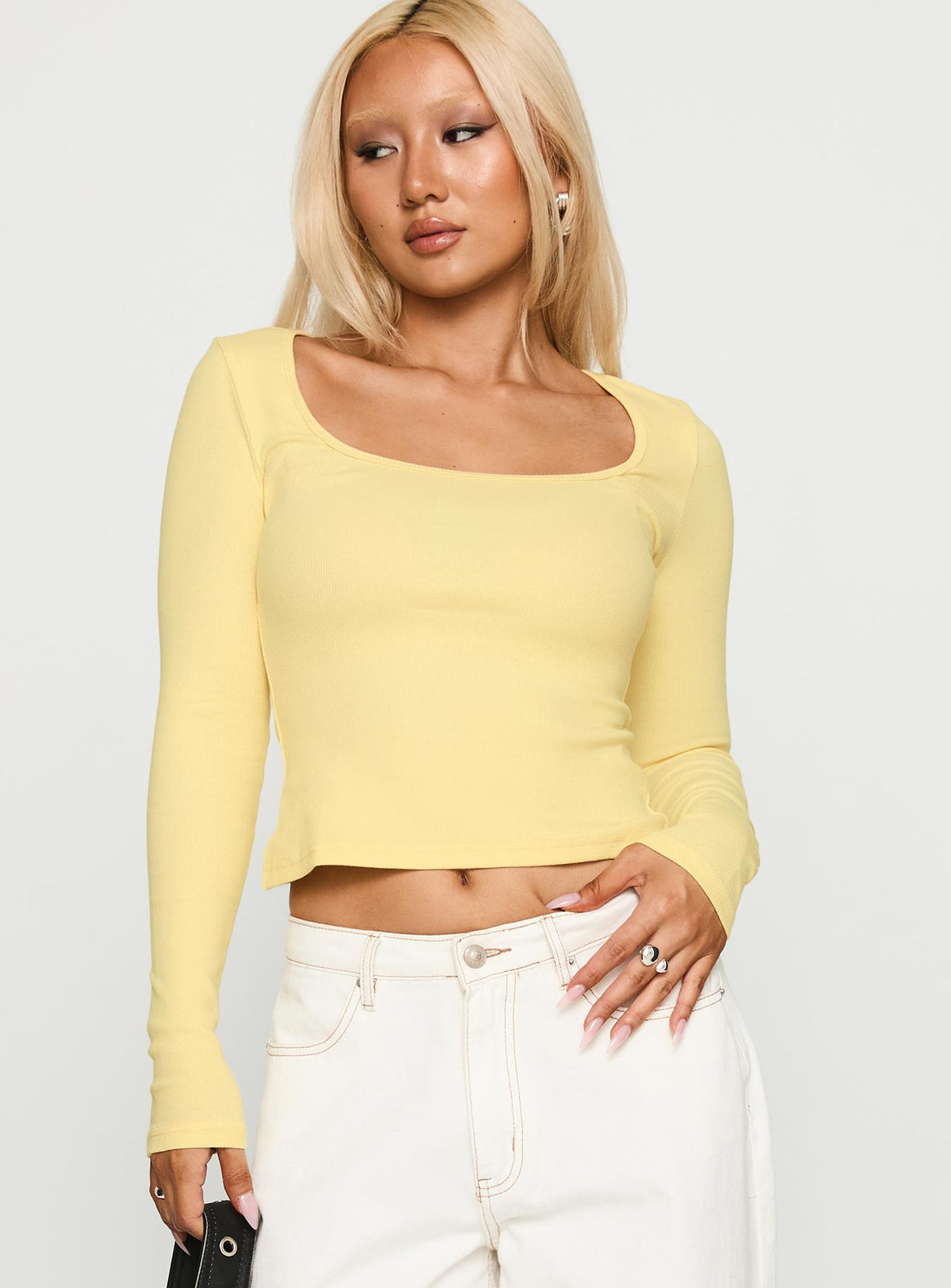 front view of model wearing Princess Polly Baseline Long Sleeve Top Yellow Full Sleeves Scoop Neck 