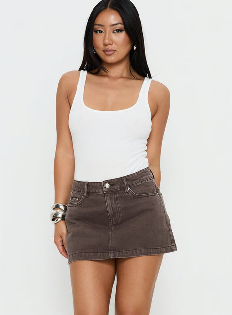   front view of model wearing Princess Polly Nicolina Low Rise Denim Mini Skirt Washed Brown Mini Skirts Skirts 