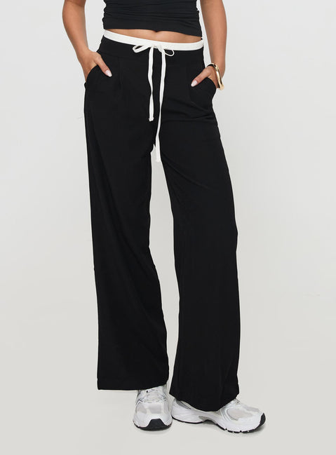 back view of model wearing Princess Polly Burna Pants Black High Rise Pants Pants 