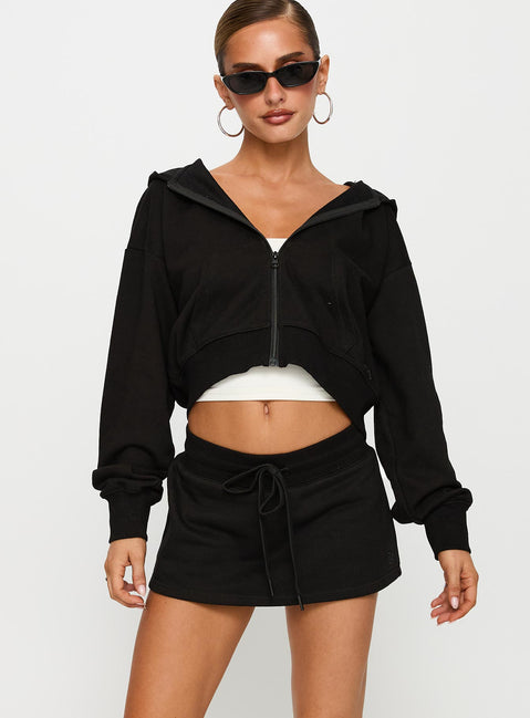 front view of model wearing Princess Polly Down Low Fleece Skort Black Low Rise Shorts 