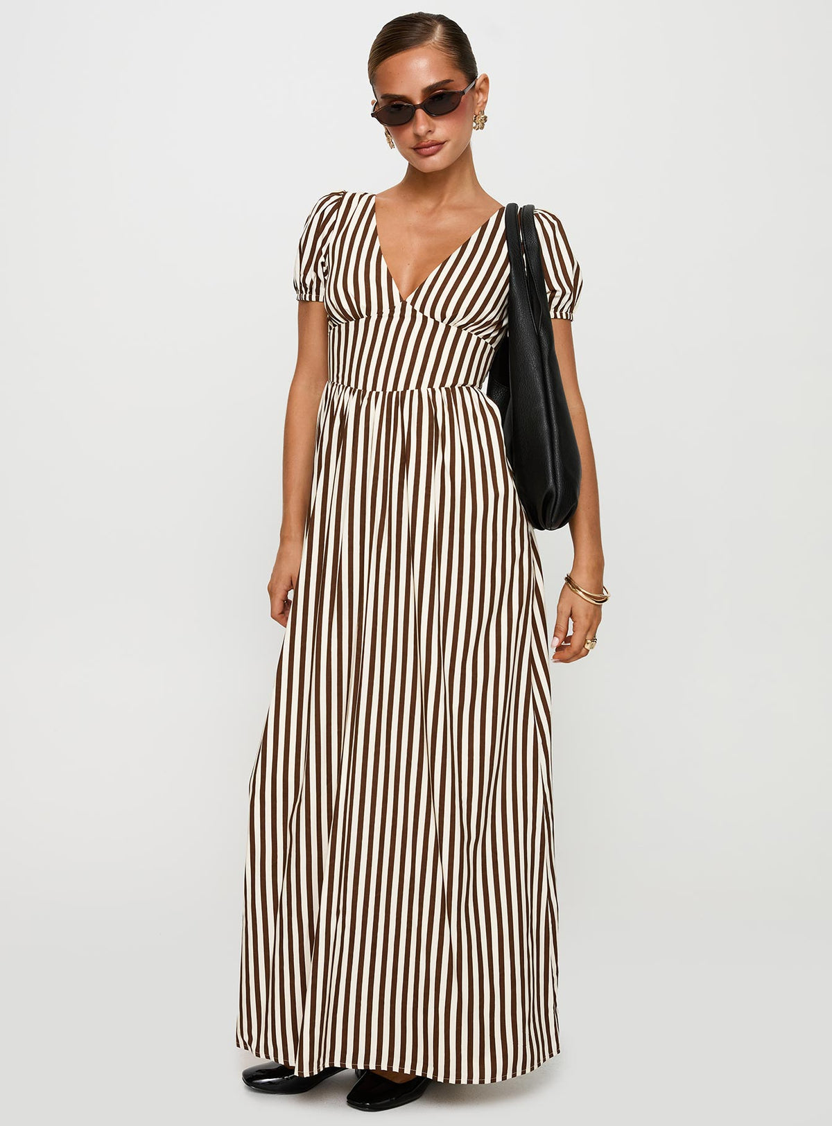 side view of model wearing Princess Polly Collyns Maxi Dress Beige Pinstripe V-Neck 
