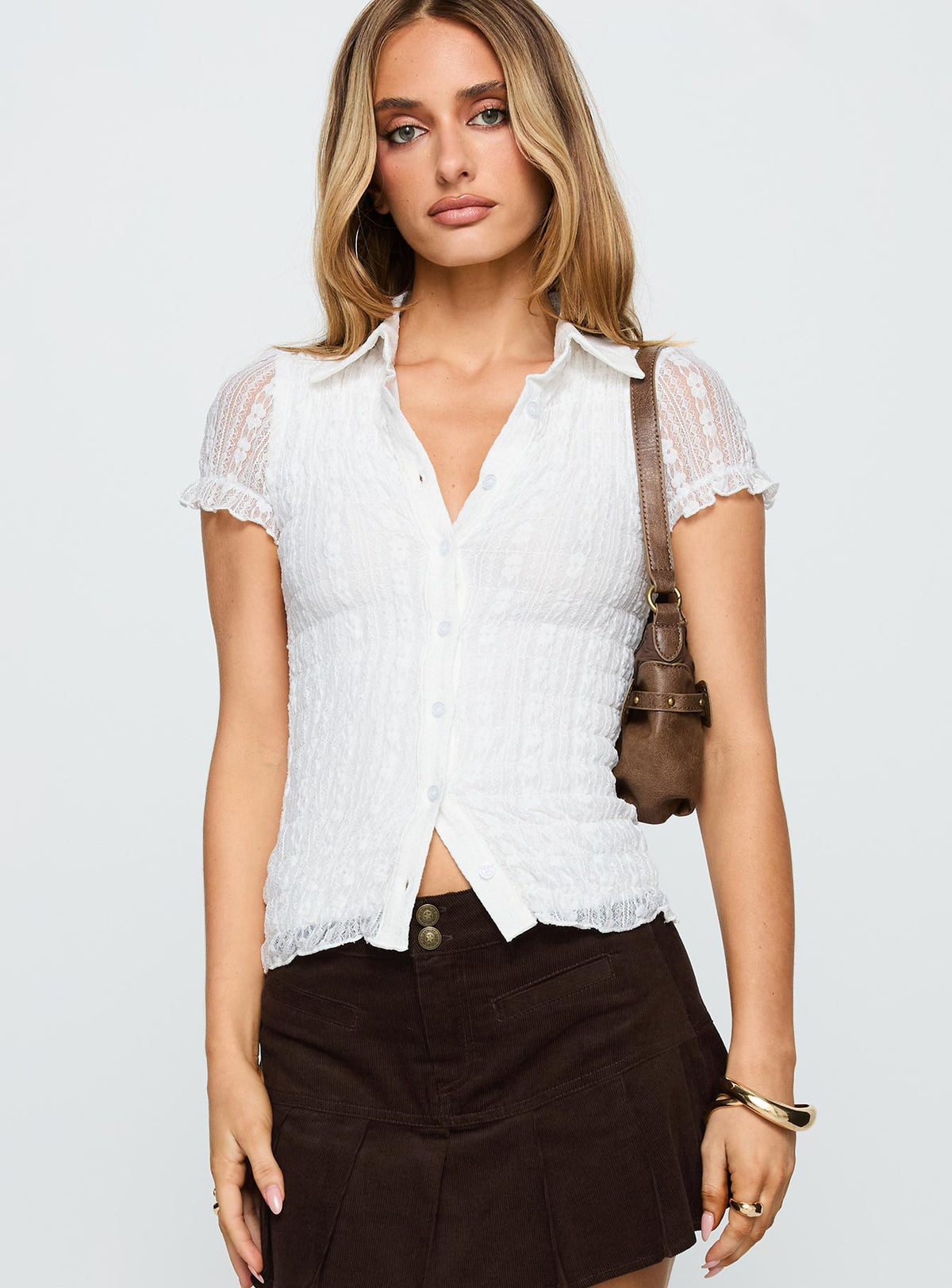 front view of model wearing Princess Polly Melaniya Button Up Top White Short Sleeves V-Neck 