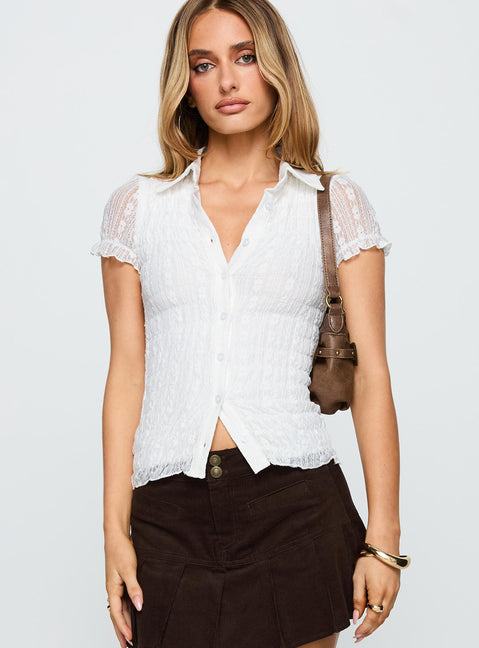 front view of model wearing Princess Polly Melaniya Button Up Top White Short Sleeves V-Neck 