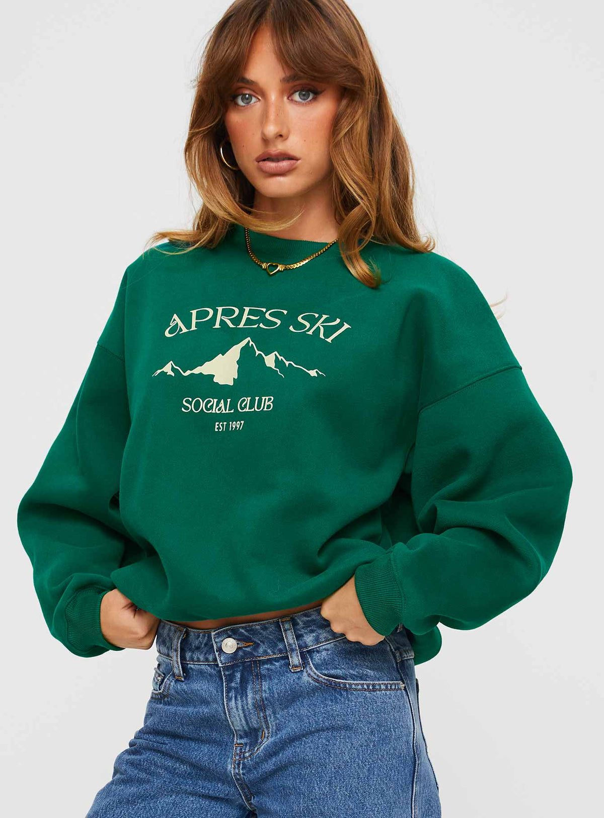 front view of model wearing Princess Polly Apres Ski Crew Neck Sweatshirt Green / Cream Jumpers 