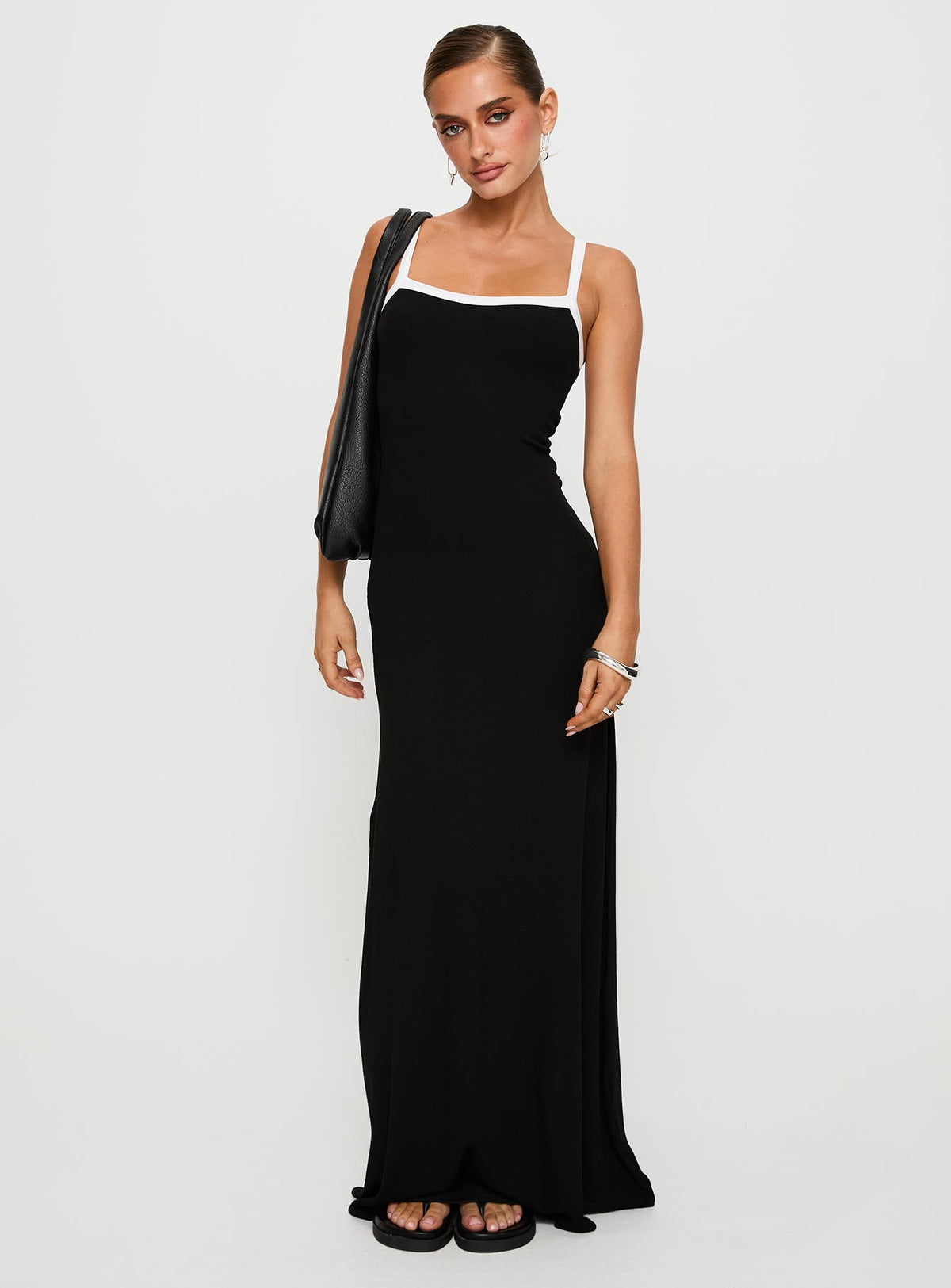 side view of model wearing Princess Polly Austrina Maxi Dress Black Square Neck 
